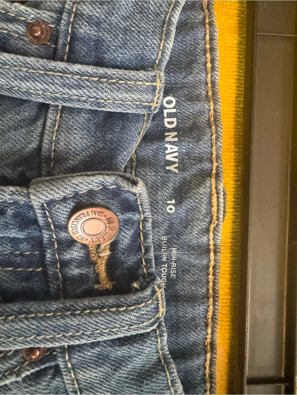 Old Navy Blue Denim Cutoff Shorts with Embroidered Smile and Daisies